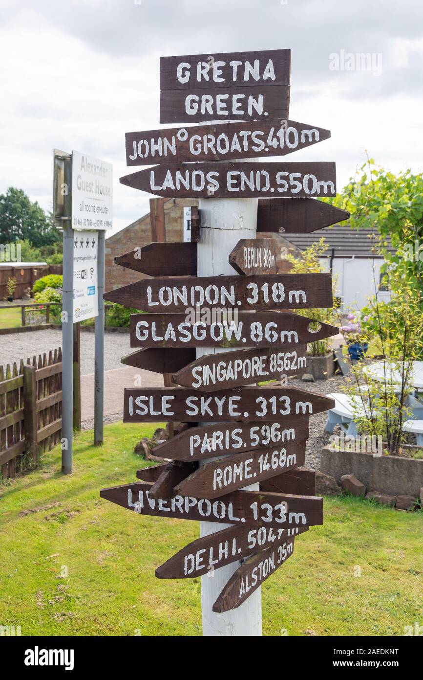 Place distance sign post Gretna Green, Gretna, Dumfries and Galloway, Scotland, United Kingdom Stock Photo