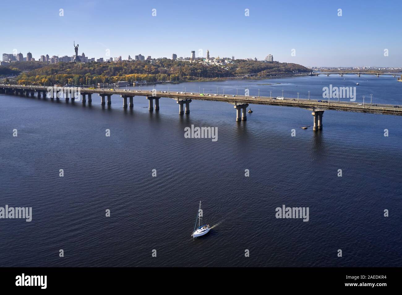 Aerial view at sunny cityscape with bridge over river Stock Photo
