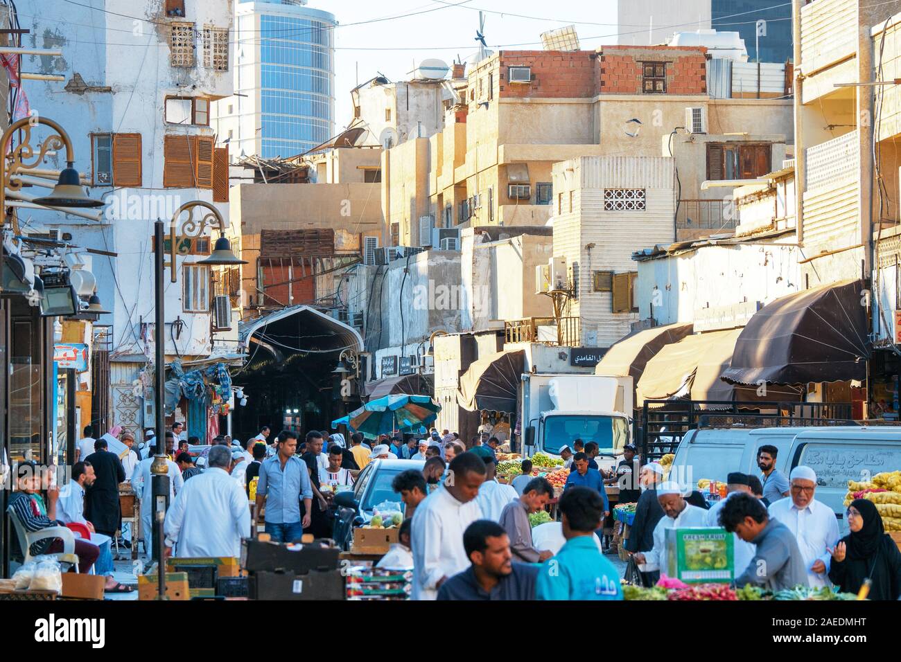 View of Arabic people bustling through the Souk Baab Makkah street market at the historic district Al Balad in Jeddah, KSA, Saudi Arabia Stock Photo