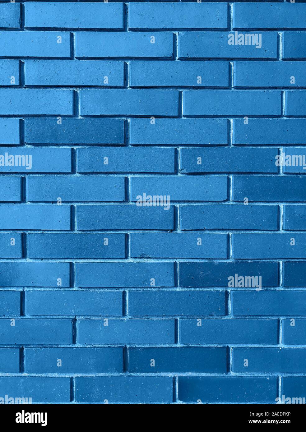 Blue background from brick wall texture pattern, wallpaper design template. Classic Blue Color is color the Year 2020. Stock Photo