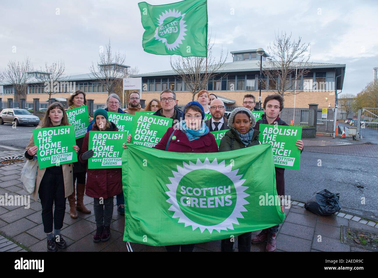 Glasgow, UK. 22 November 2019. Pictured: (front row left) Cllr Kim Long and (front row right) Mandia Kanyange - who has gone through the asylum process, stands together with Patrick Harvie MSP - Co Leader of the Scottish Green Party campaigns with local candidates, councillors and party members for the abolition of the home office.  Credit: Colin Fisher/Alamy Live News. Stock Photo