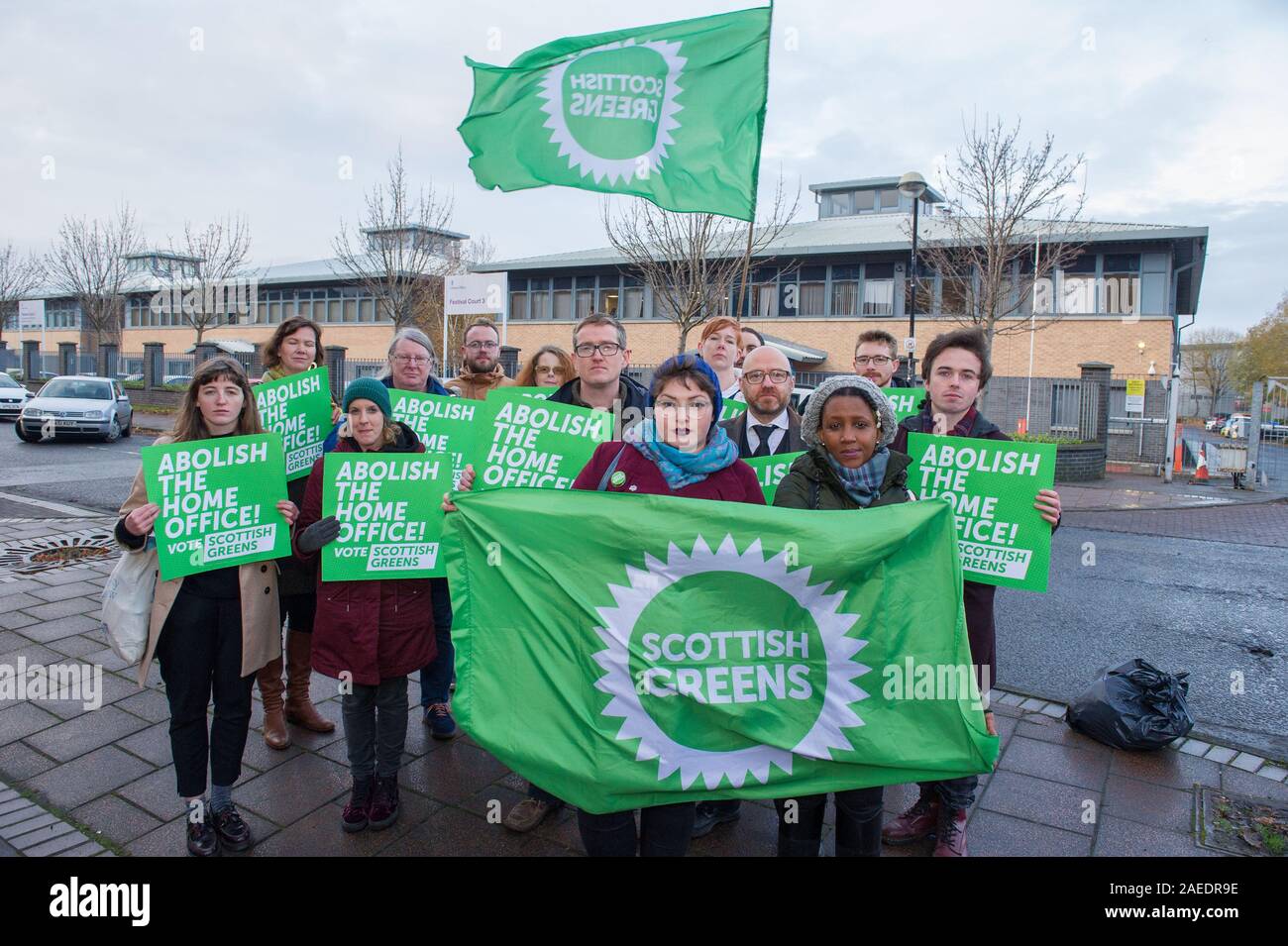 Glasgow, UK. 22 November 2019. Pictured: (front row left) Cllr Kim Long and (front row right) Mandia Kanyange - who has gone through the asylum process, stands together with Patrick Harvie MSP - Co Leader of the Scottish Green Party campaigns with local candidates, councillors and party members for the abolition of the home office.  Credit: Colin Fisher/Alamy Live News. Stock Photo