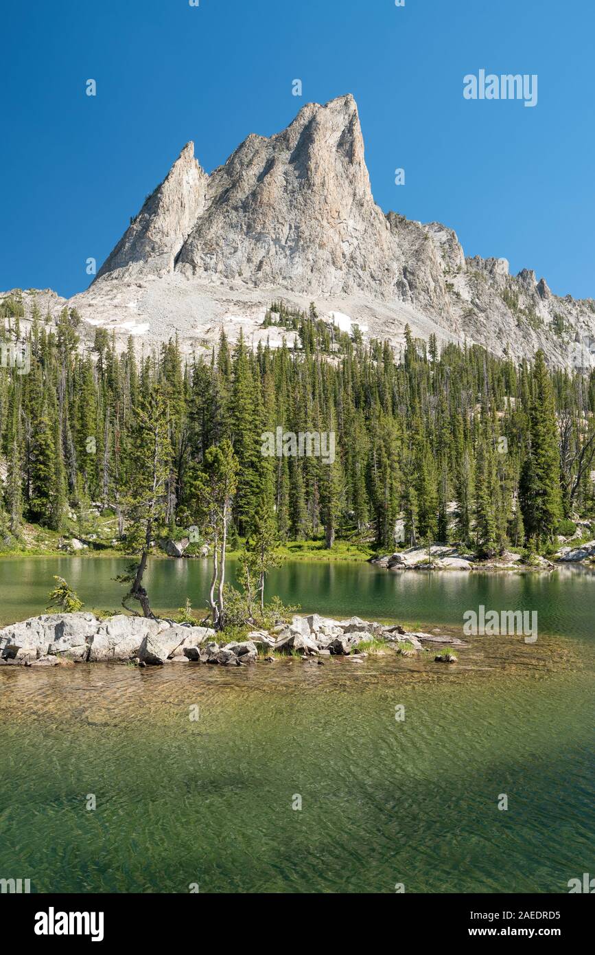El Capitan peak and an unamed lake in Idaho's Sawtooth Mountains. Stock Photo