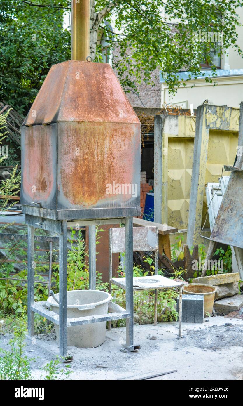 Old Abandoned Incinerator Hi Res Stock Photography And Images Alamy   Small Rusty Metal Incinerator Stove In Summer Outdoor Study Old Oven And Chair With White Dust Or Ash On Outdoor In Summer Handicraft Workshop 2AEDW26 