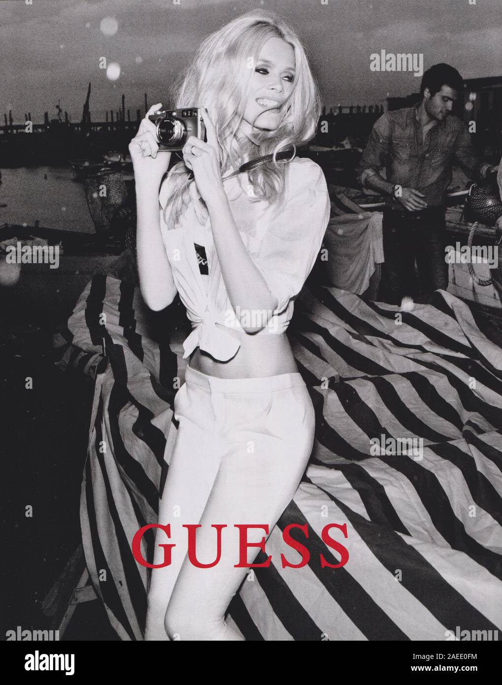 poster advertising GUESS with Claudia Schiffer in paper magazine from 2012  year, advertisement, creative GUESS advert from 2010s Stock Photo - Alamy