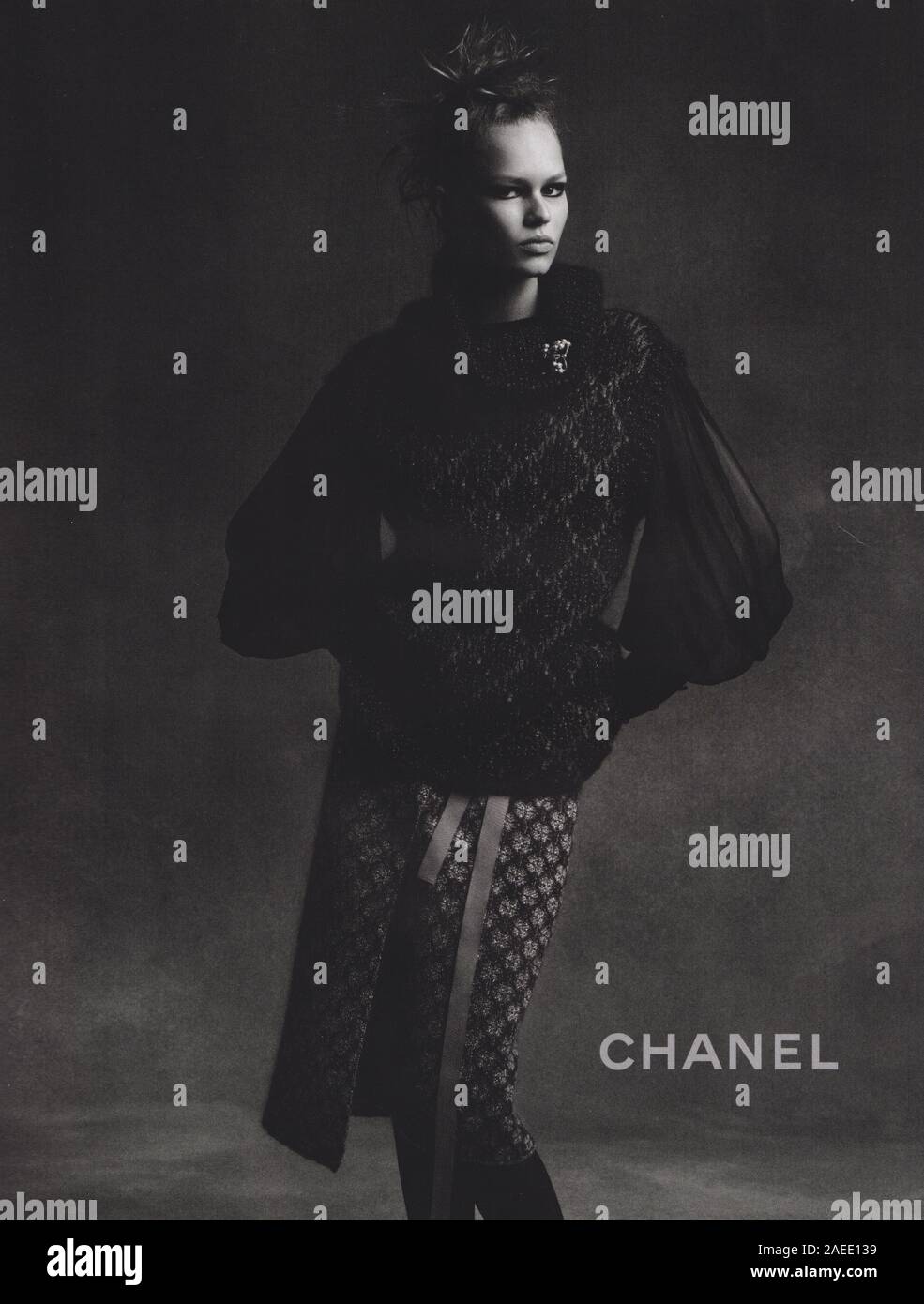 poster advertising CHANEL fashion house with Anna Ewers in paper ...