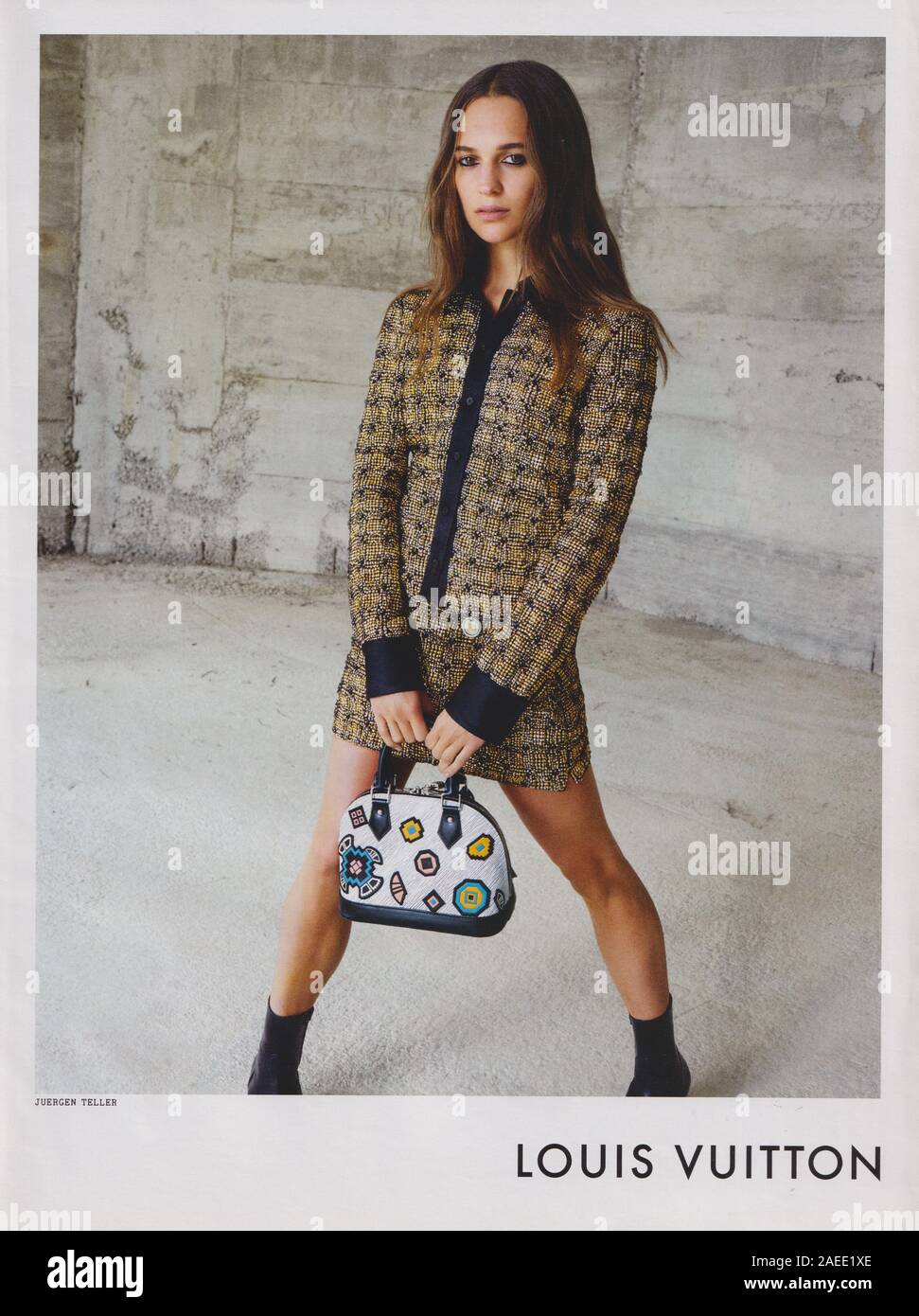 poster advertising Louis Vuitton handbag with Alicia Vikander actress in  paper magazine from 2015 year, advertisement, creative LV advert from 2010s  Stock Photo - Alamy