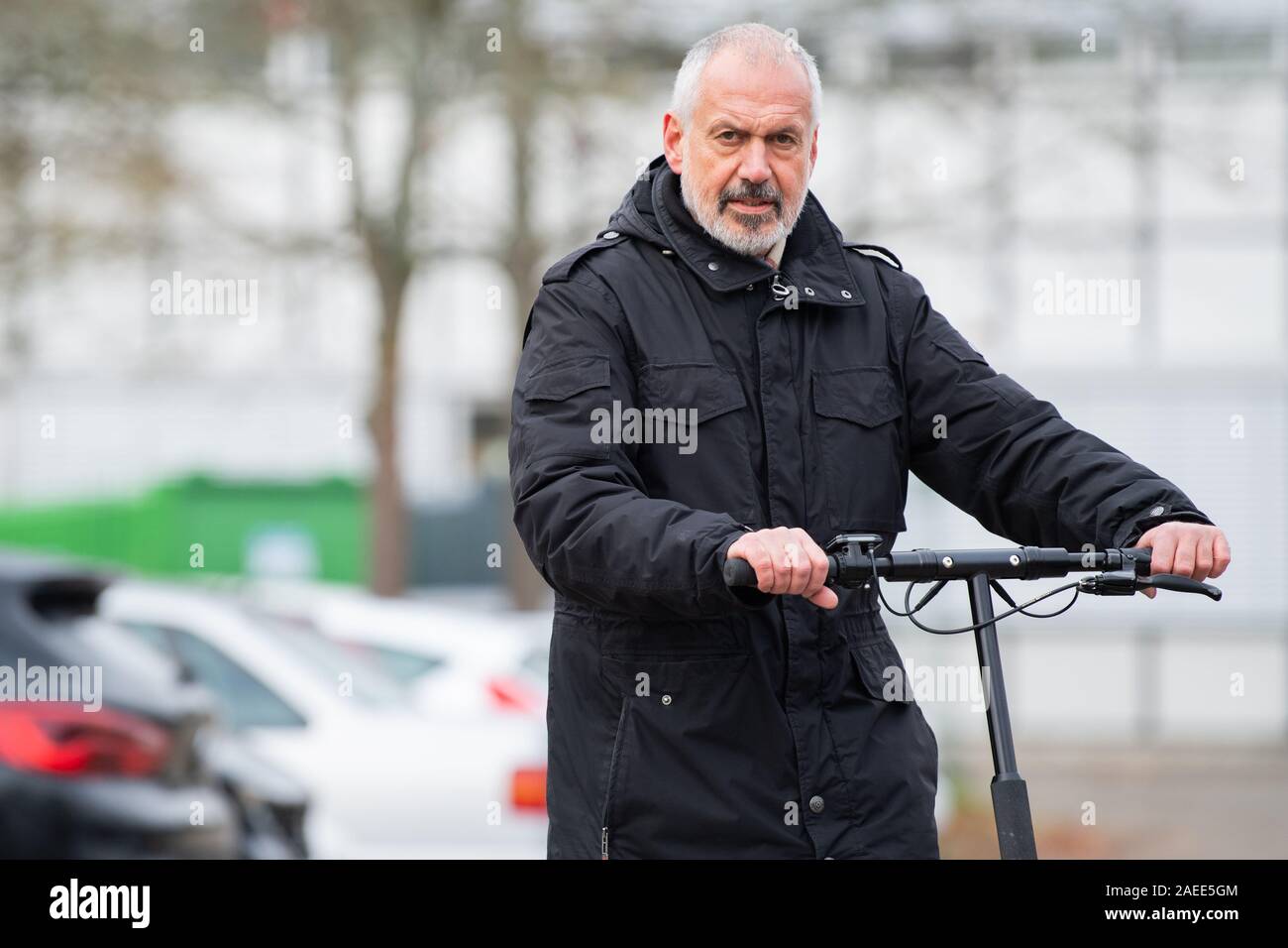 Stuttgart, Germany. 22nd Nov, 2019. Manfred Wacker, deputy head of the  Chair of Traffic Planning and Traffic Control Technology at the University  of Stuttgart, is standing on a parking lot with a