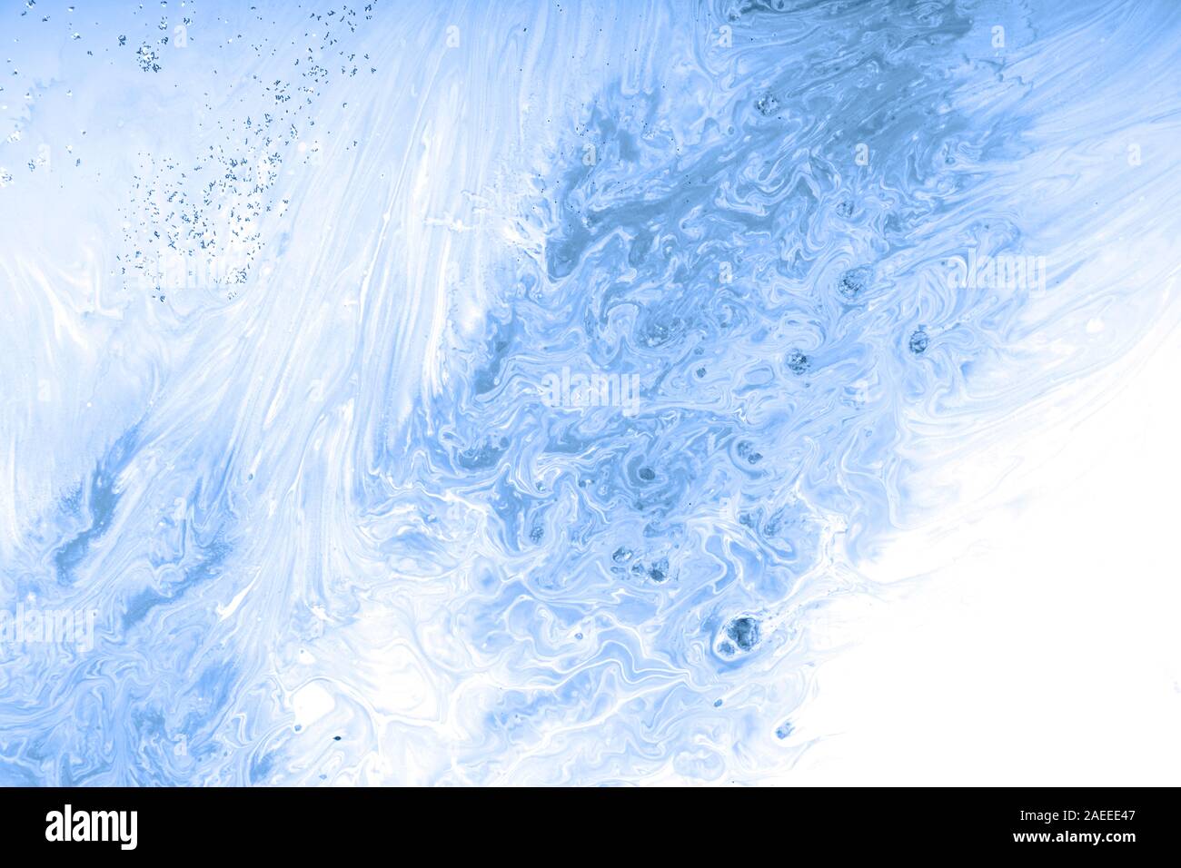 Trend abstraction of blue acrylic paint on a white background Stock Photo