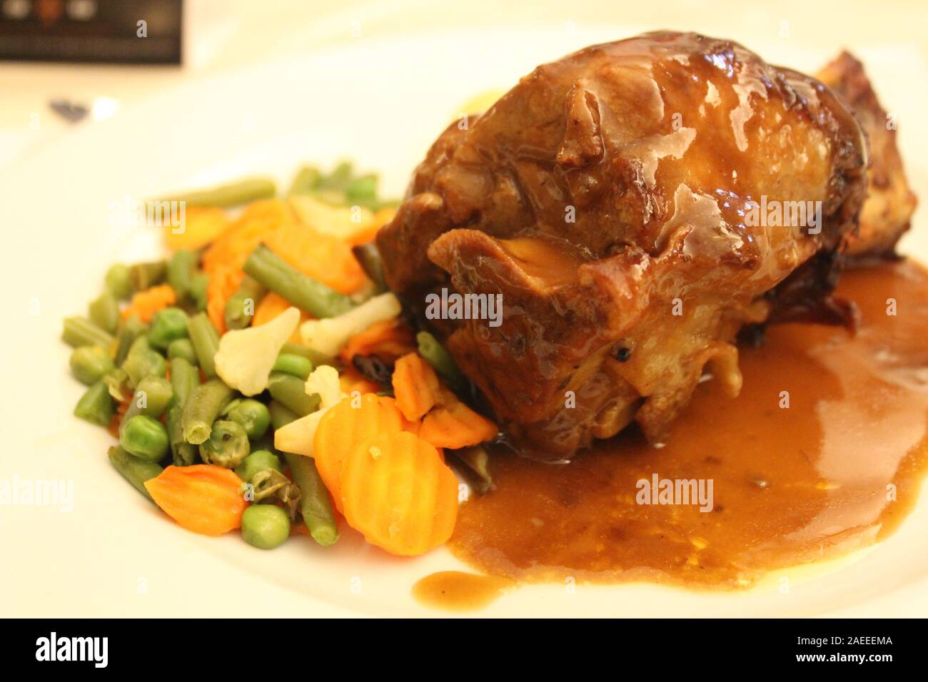 The portrait of food pork knuckles with source and vegetable Stock