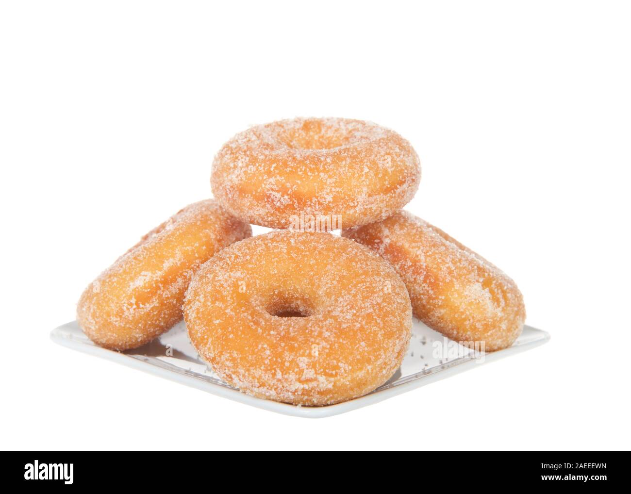 Square plate with sugar coated  donuts stacked, isolated on white Stock Photo