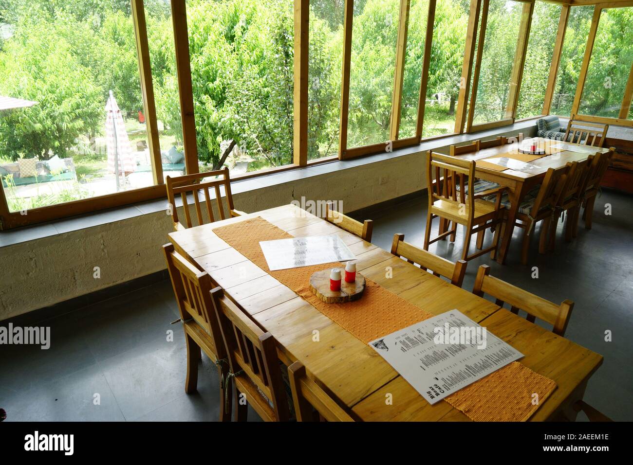 Restaurant tables, Big Bear Cafe, Alternate Terrain, Manali, Himachal Pradesh, India, Asia Stock Photo
