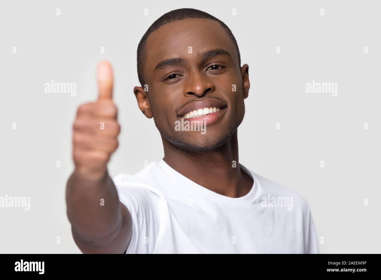 Happy black man thumbs up hi-res stock photography and images - Alamy