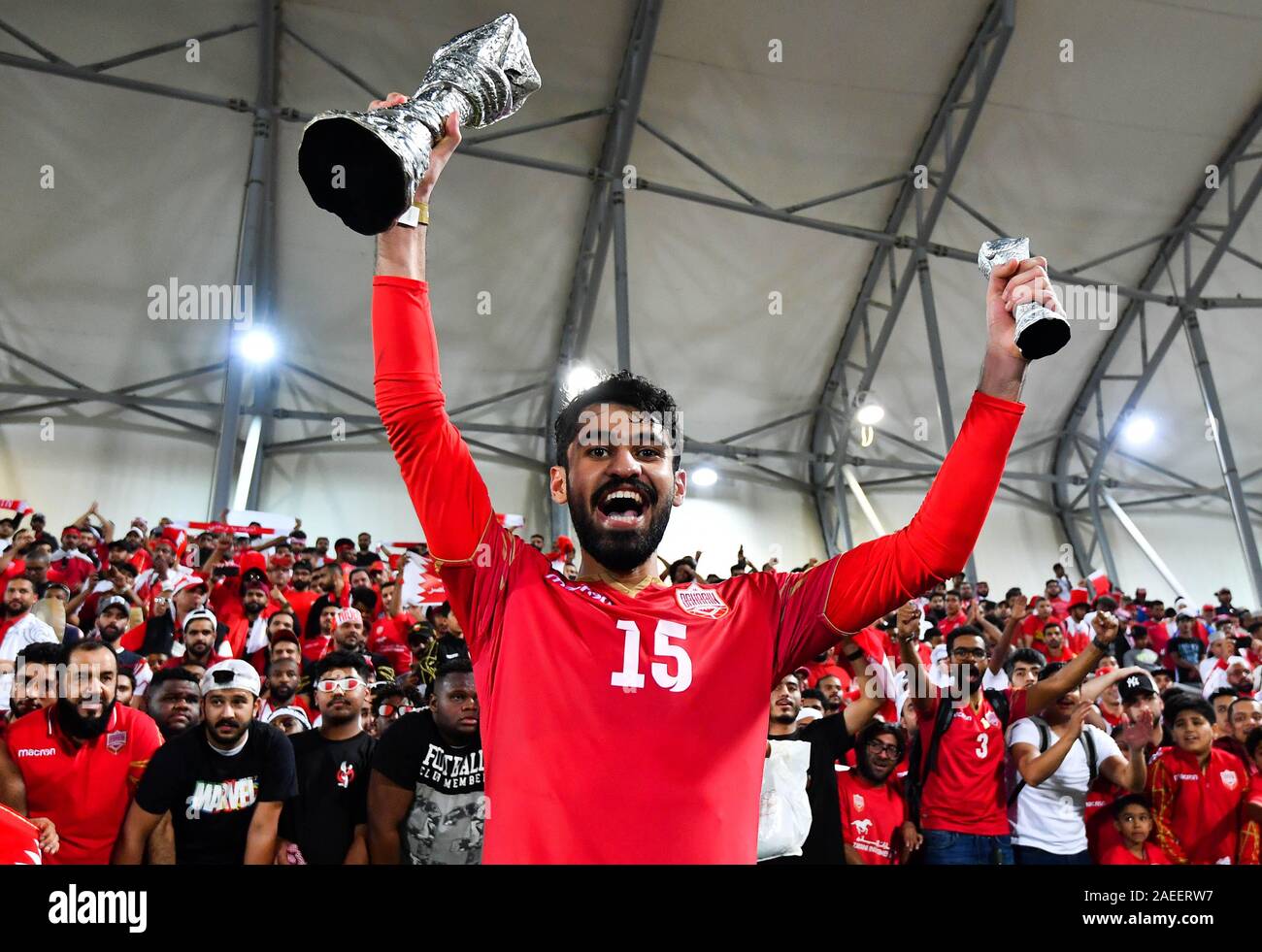 Doha, Qatar. 8th Dec, 2019. Bahrain's player Jasim Al-Shaikh celebrates with the trophy after winning the 24th Arabian Gulf Cup 2019 final match between Bahrain and Saudi Arabia in Doha, Qatar, Dec. 8, 2019. Credit: Nikku/Xinhua/Alamy Live News Stock Photo