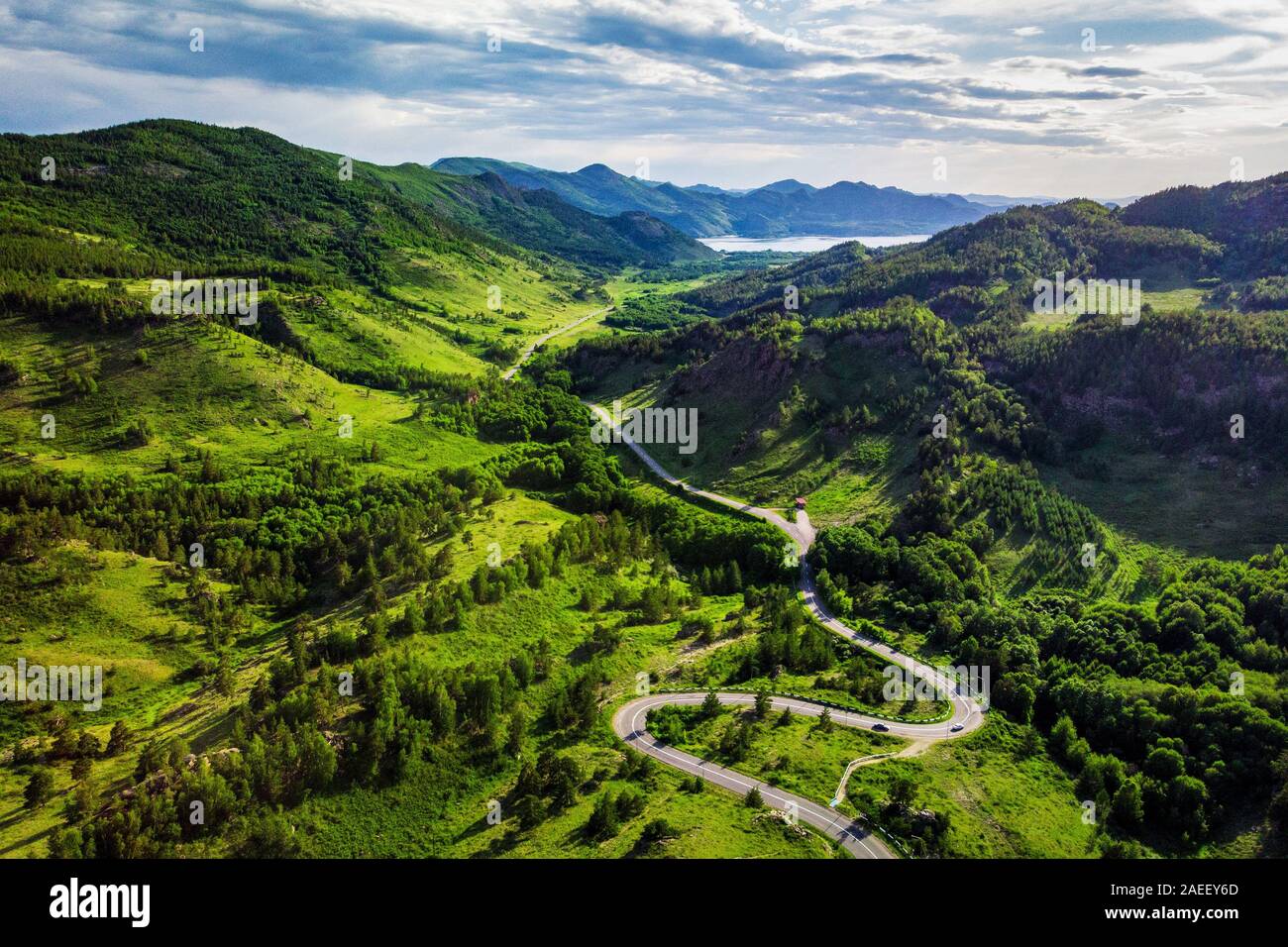 Mountain serpentine road to the Zhasybay lake. Sunny summer weather. Bayanaul National Park. Kazakhstan. Stock Photo