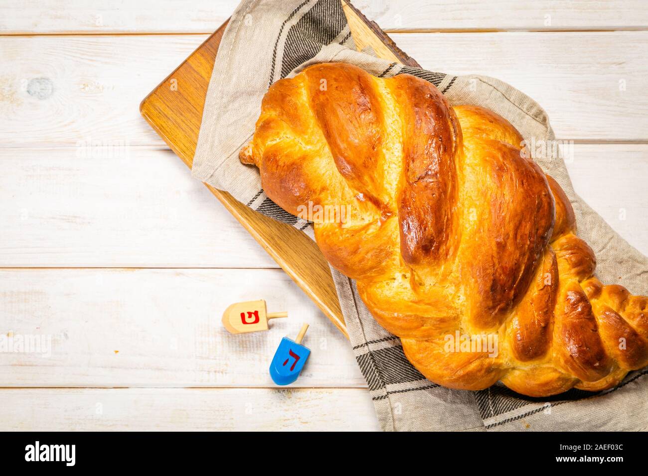 Traditional jewish bread challah on wood background Stock Photo