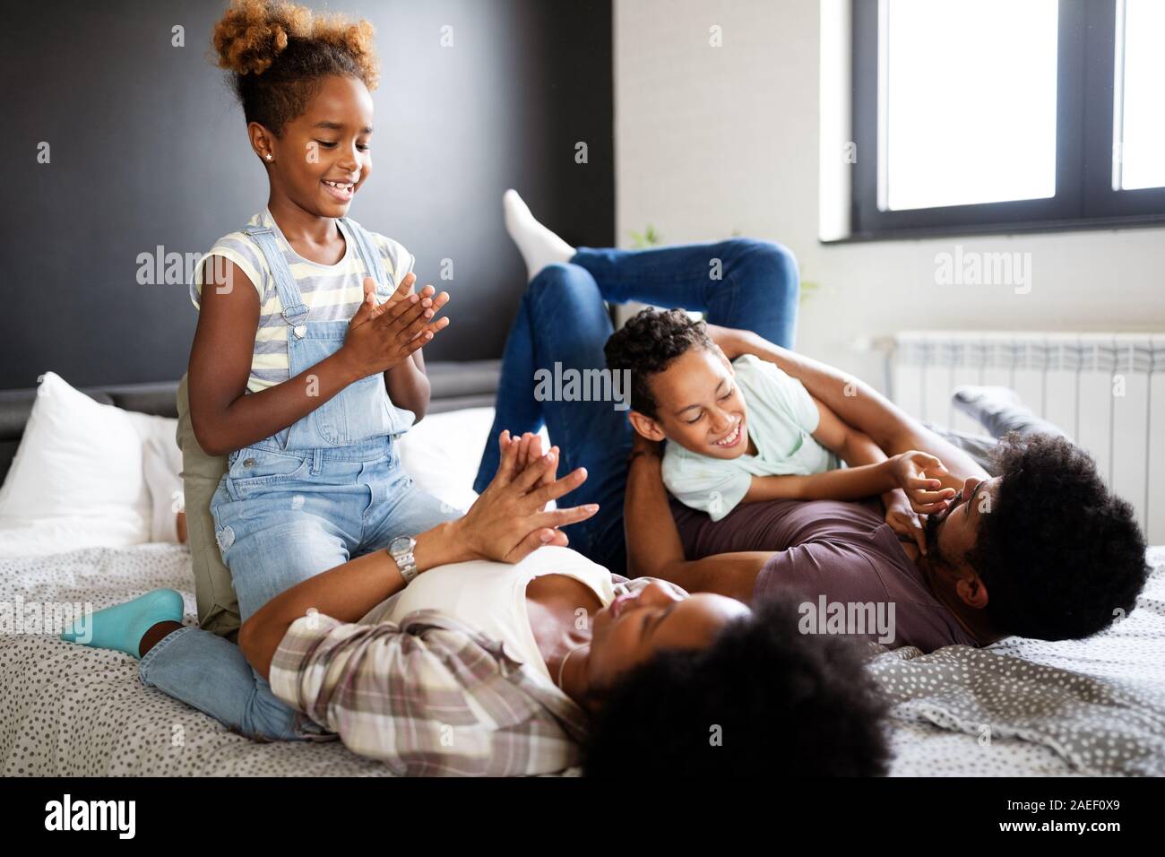 Young family being playful and spending fun time together at home Stock Photo