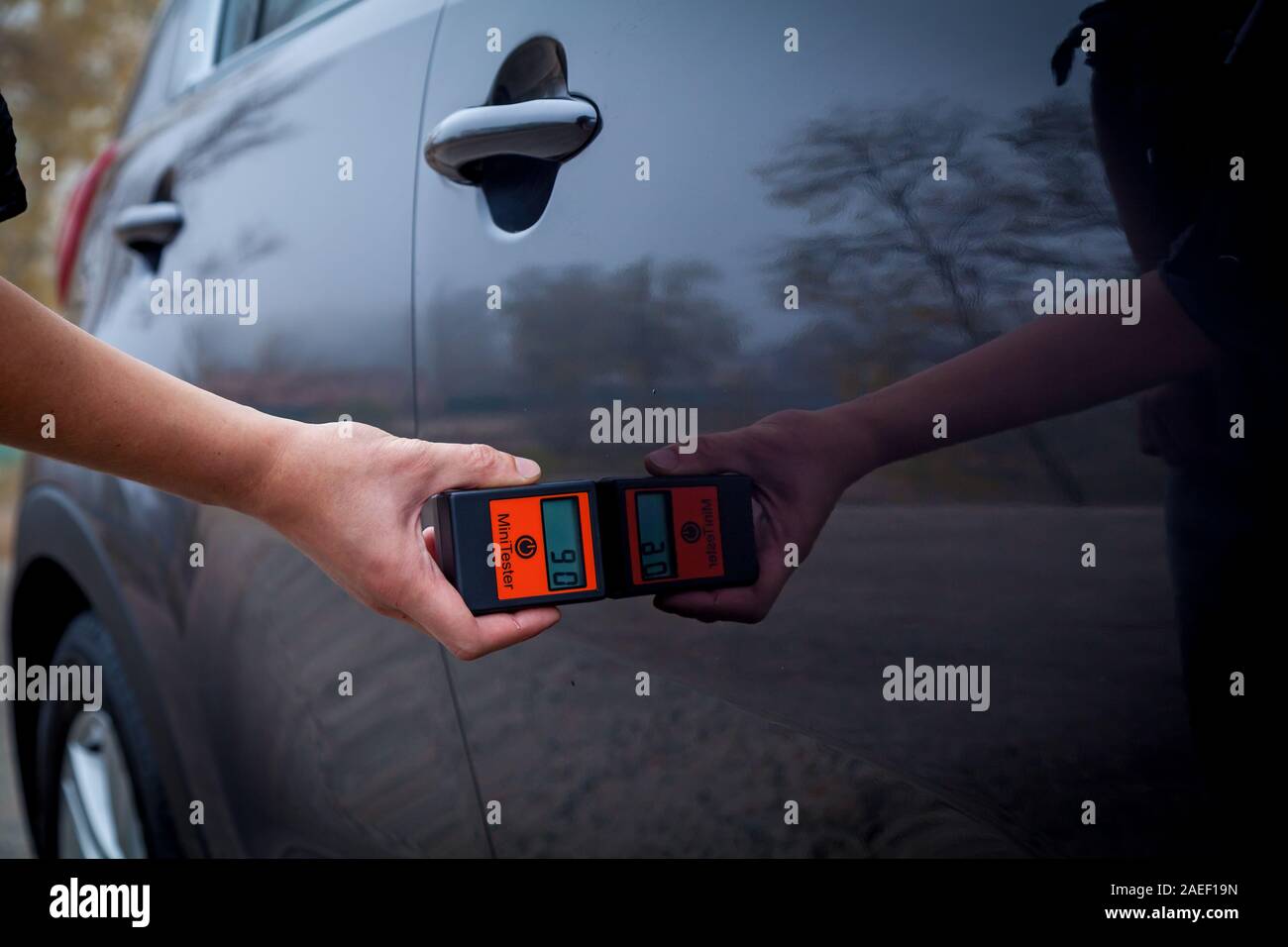Measuring the thickness of the car paint coating in black color using a