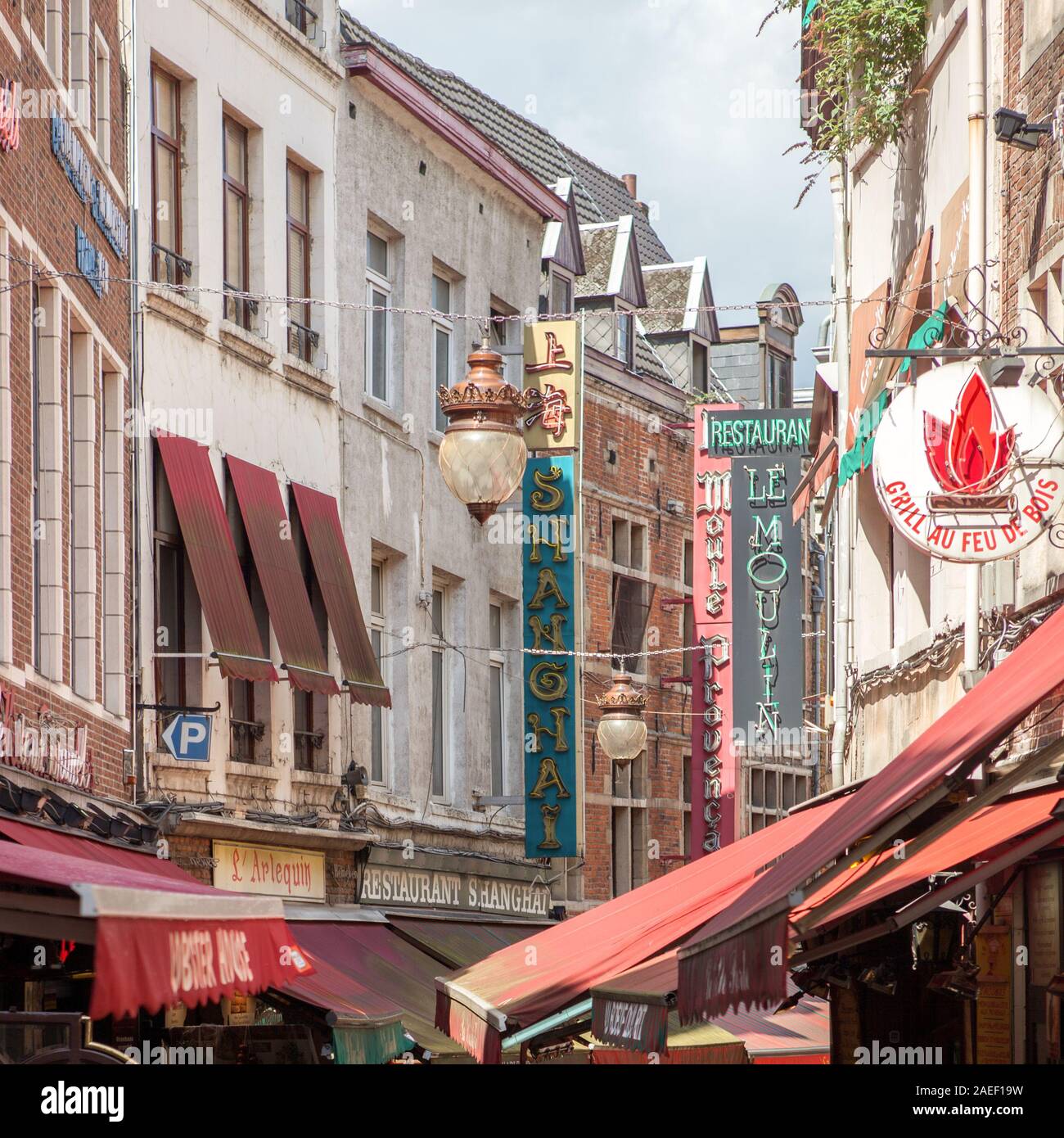 BRUSSELS, BELGIUM -February 17, 2014: famous street Ilot Sacré (also known as The Belly of Brussels) with many restaurants in Brussels, Belgium Stock Photo