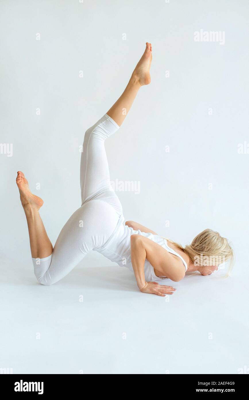 blonde cheerful woman doing yoga asanas. Healthy lifestyle and sport concept Stock Photo