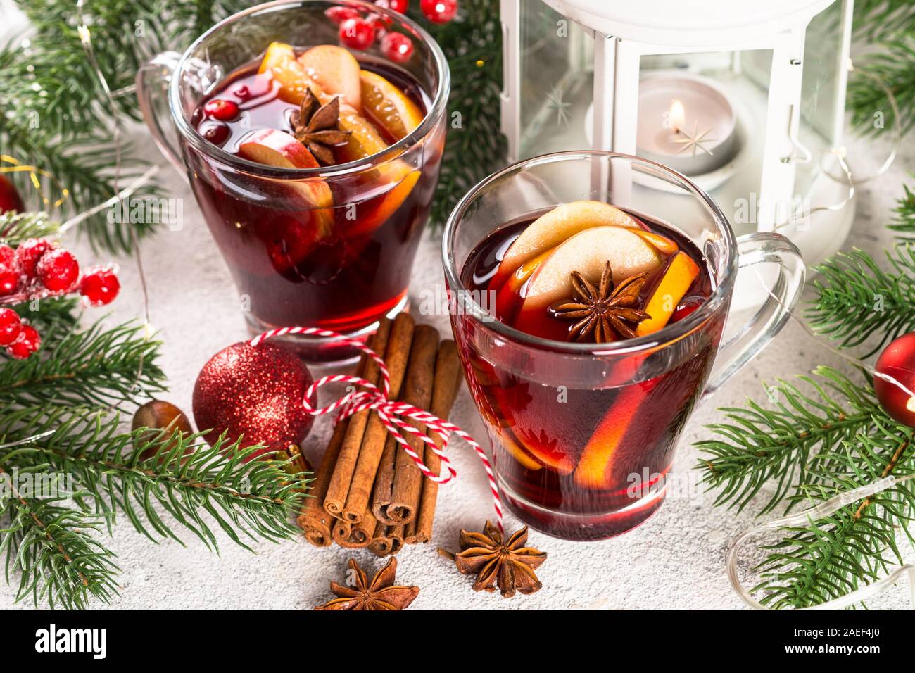 Mulled wine with christmas decorations on white Stock Photo - Alamy