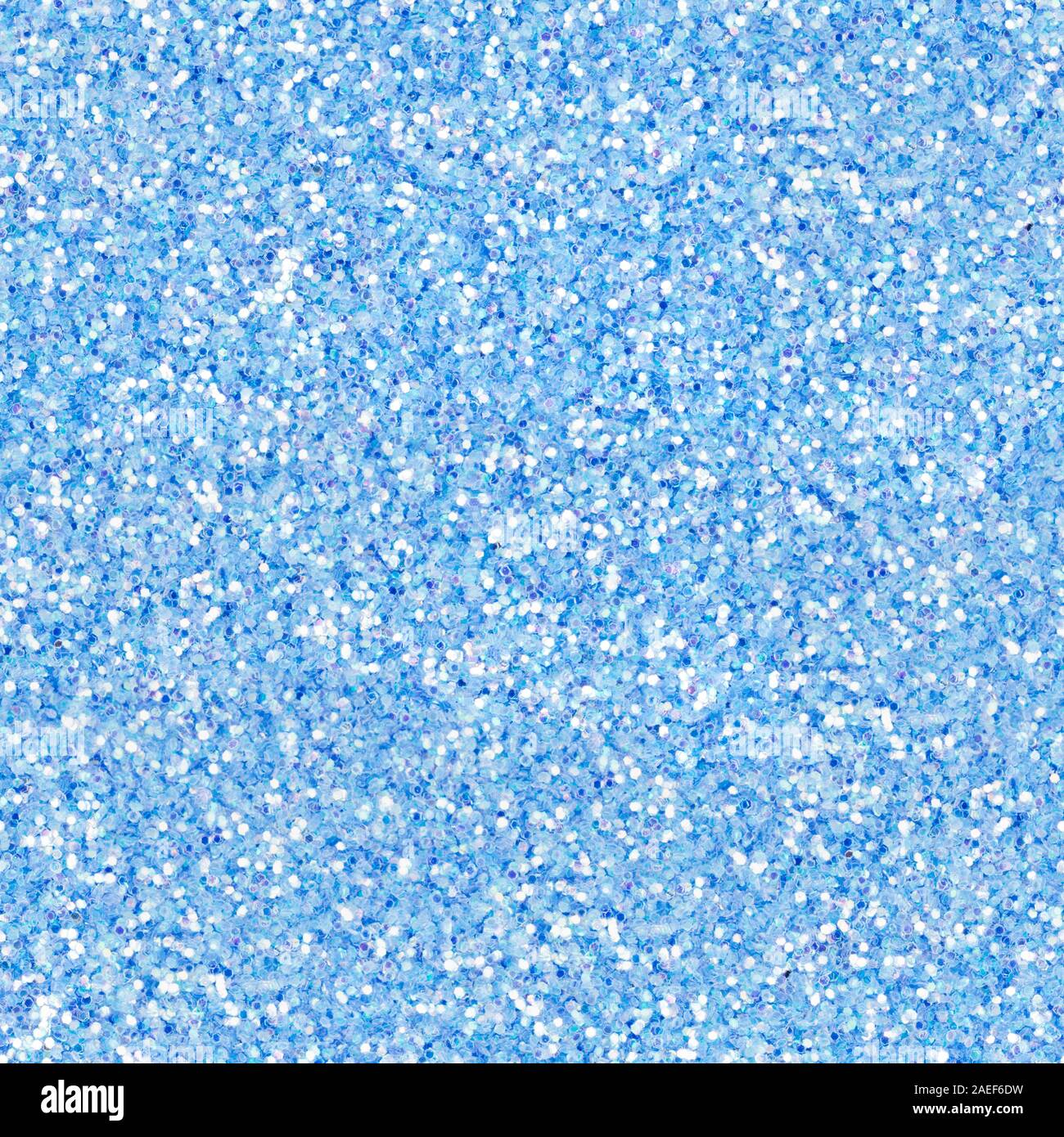 Bright light blue glitter, sparkle confetti texture. Christmas abstract background, seamless pattern. Stock Photo