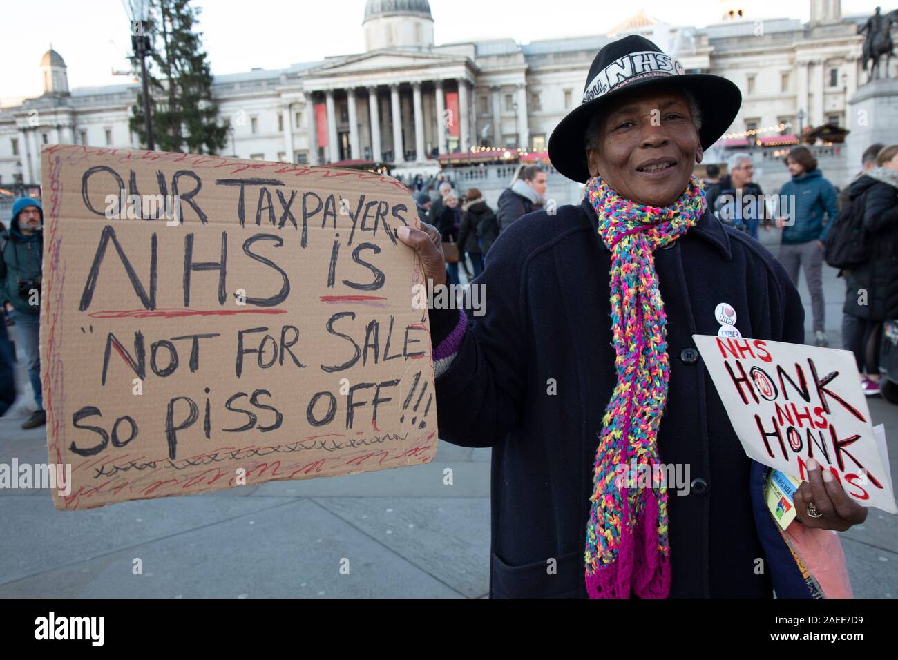 Protester Gloria at the No to Trump, No to NATO, Hands off our NHS Demonstration on 3rd December 2019 in London, United Kingdom. Donald Trump is visiting London or the NATO Heads of State summit on the 70th anniversary of the organisation, which the Queen will be hosting a reception for NATO leaders at Buckingham Palace. Meanwhile, there is fear that Boris Johnson and Donald Trump will be in discussion about opening up the NHS to US corporations. Organisers were Together Against Trump which is a collaboration between the Stop Trump Coalition and Stand Up To Trump. Stock Photo