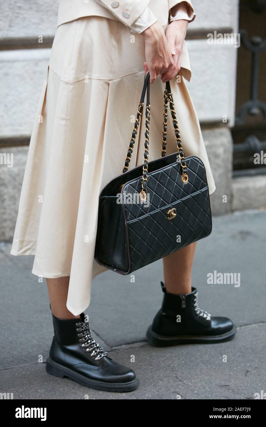MILAN, ITALY - SEPTEMBER 21, 2019: Woman with beige dress and black leather Chanel  bag before Giorgio Armani fashion show, Milan Fashion Week street s Stock  Photo - Alamy