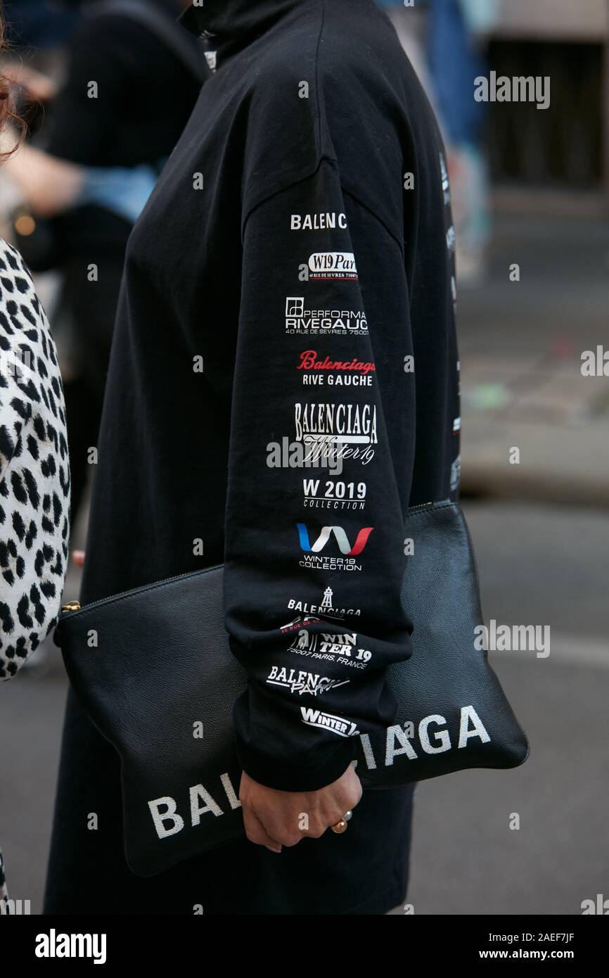 MILAN, ITALY - SEPTEMBER 21, 2019: Woman with black Balenciaga dress and  bag before Giorgio Armani fashion show, Milan Fashion Week street style  Stock Photo - Alamy