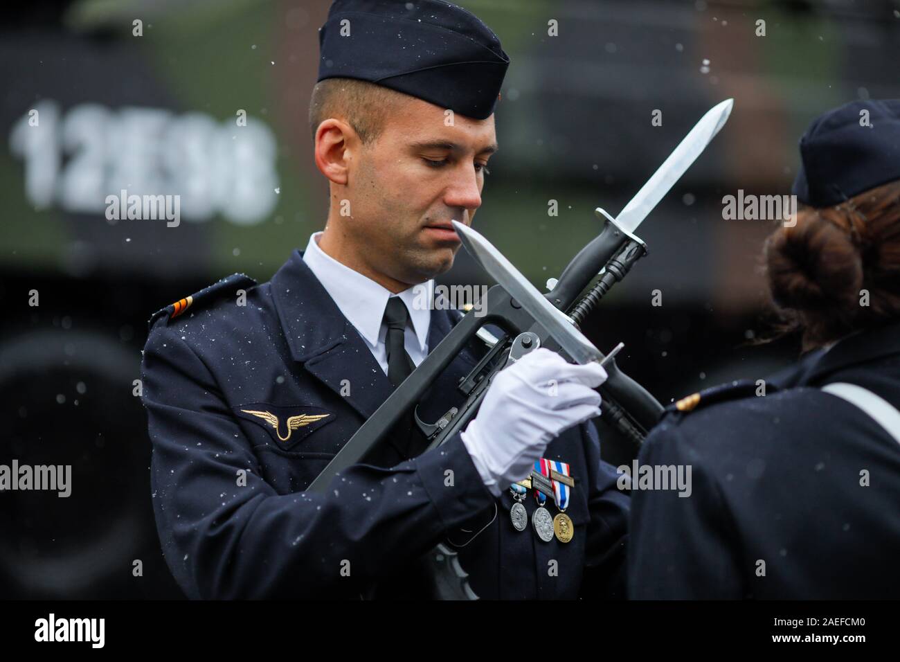 Bucharest, Romania - December 01, 2019:French soldiers attach a bayonet to their gun during the Romanian National Day military parade. Stock Photo
