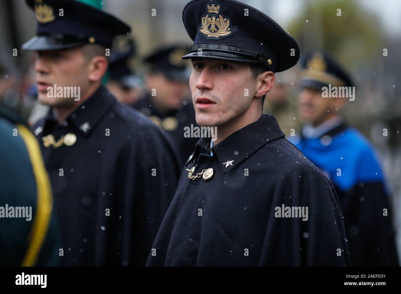 Bucharest, Romania - December 01, 2019: Italian soldiers in ceremonial uniforms take part at the Romanian National Day military parade during a snowy Stock Photo