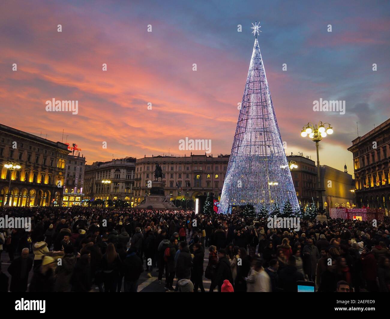 Milan, Italy - December 7, 2019 Blurred people gathers as a crowd at Piazza Duomo in Milan to welcome Christmas season Stock Photo