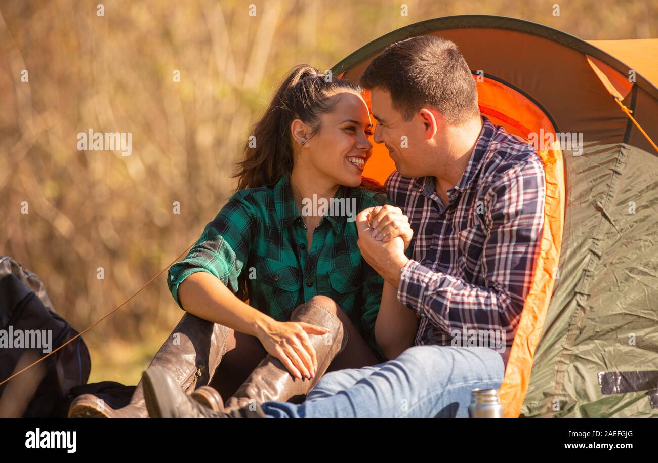 Romantic couple sitting in tent hi-res stock photography and images - Alamy