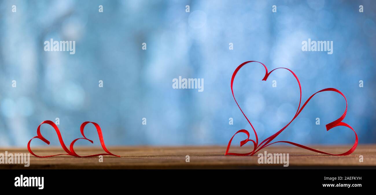 Valentines Day Background - Ribbon Shaped Hearts bokeh background Stock Photo