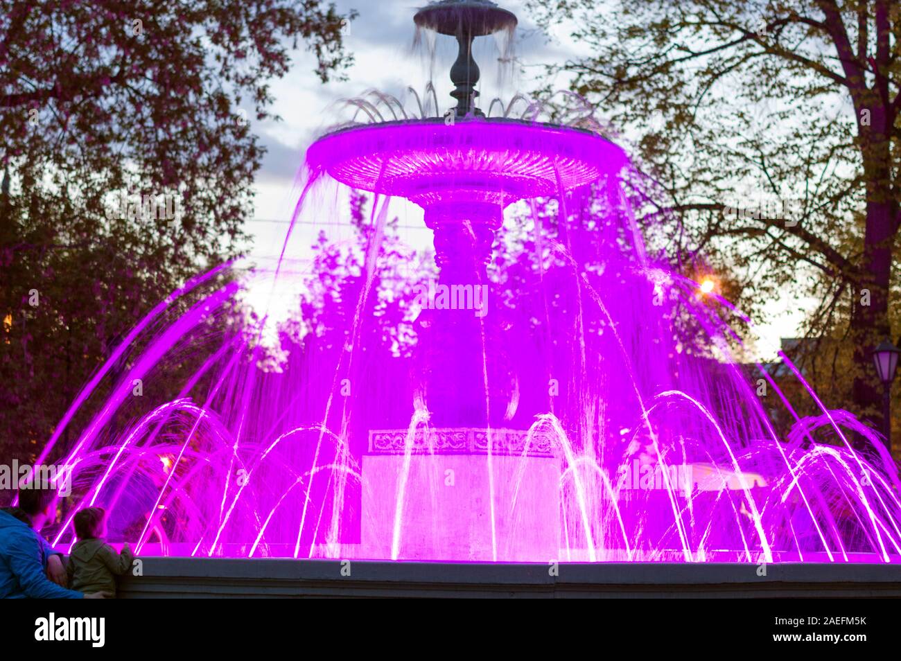 The city fountain, in Minin Square, is highlighted in different colors, yellow, purple, red. Close-up. Russia. Stock Photo