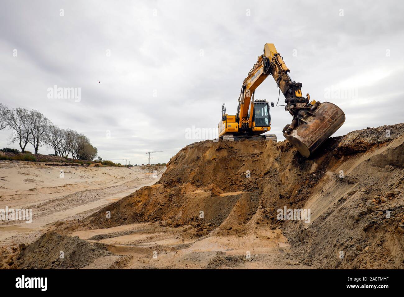 Oberhausen, Ruhr area, North Rhine-Westphalia, Germany - Excavator during earthworks within the scope of the Emscher conversion, new construction of t Stock Photo