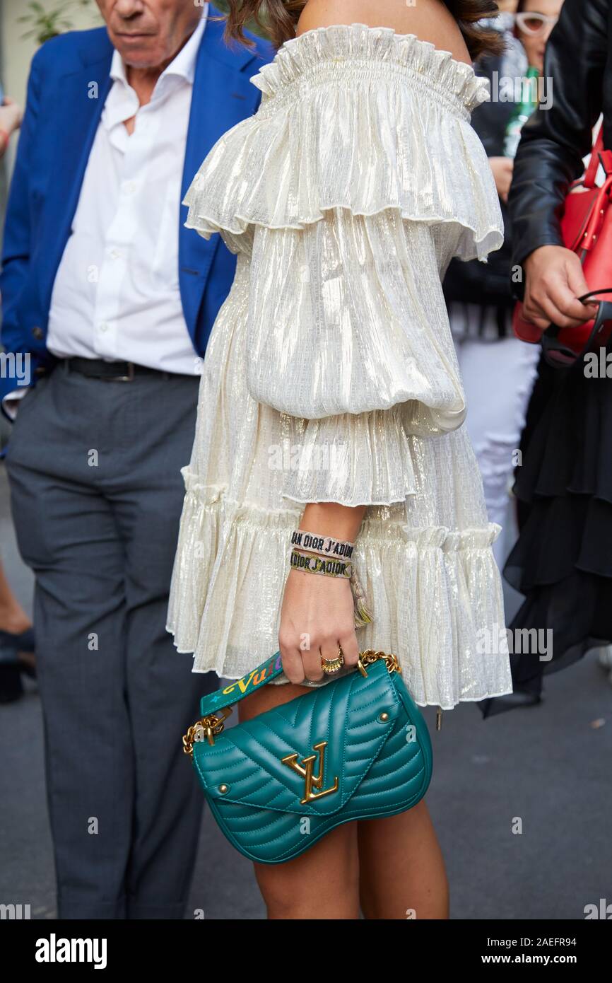 MILAN, ITALY - SEPTEMBER 21, 2019: Woman with green leather Louis Vuitton  bag and white silver dress before Giorgio Armani fashion show, Milan  Fashion Stock Photo - Alamy