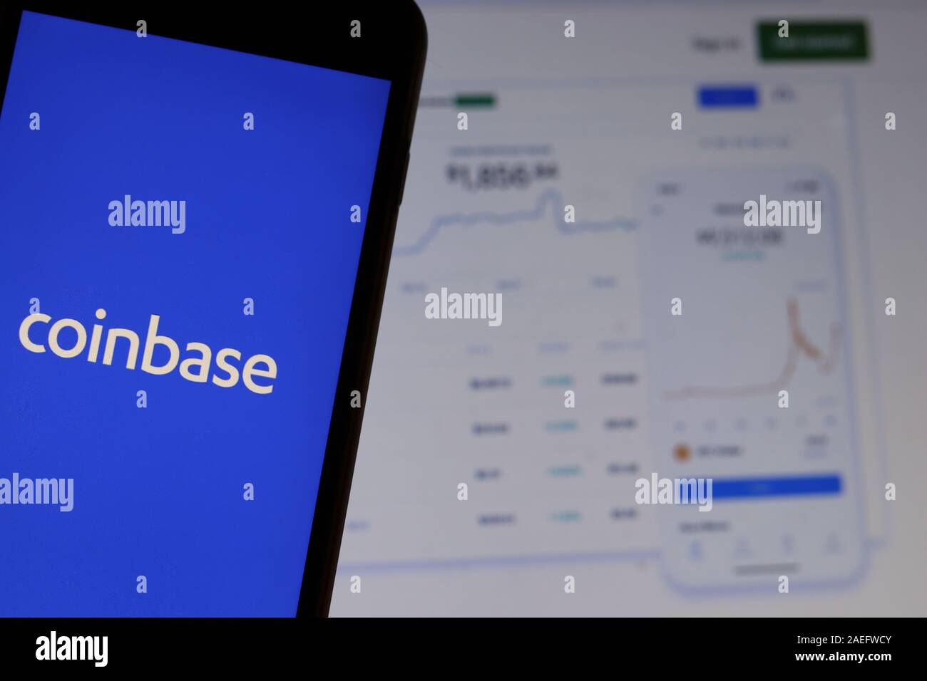 Los Angeles, USA - 10 March 2020: Coinbase icon app logo on phone screen close up with website on blurry background, Illustrative Editorial Stock Photo