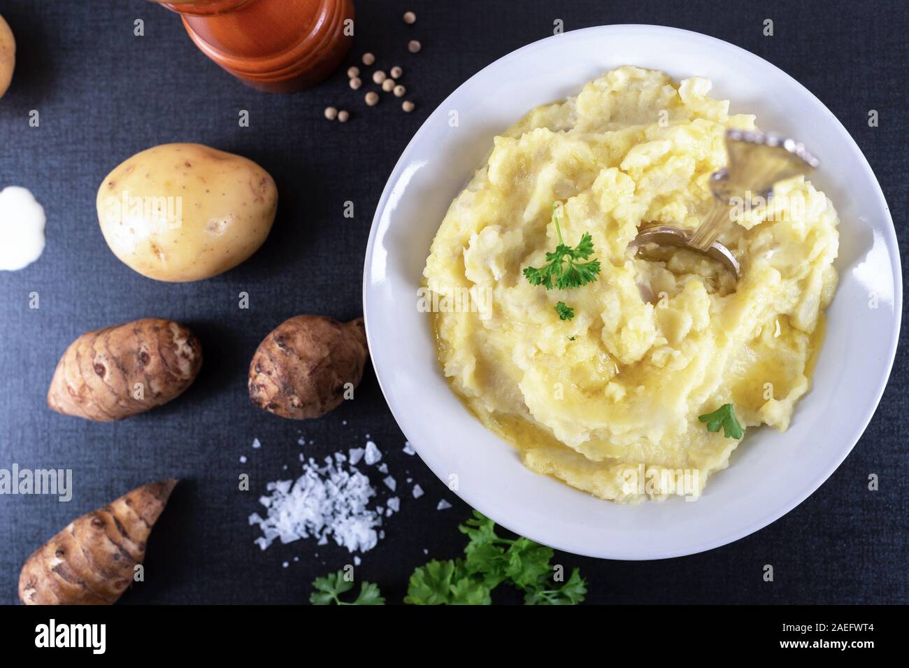 Organic Jerusalem artichoke and potato mash with cream, butter, sea salt , white pepper and parsley Stock Photo