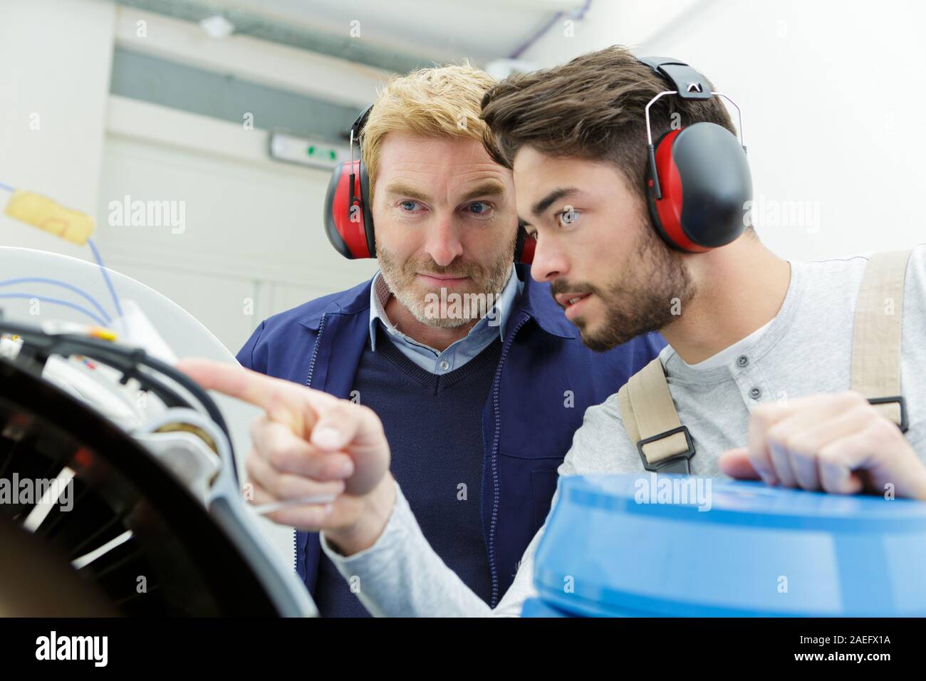 confident engineers working in the factory Stock Photo