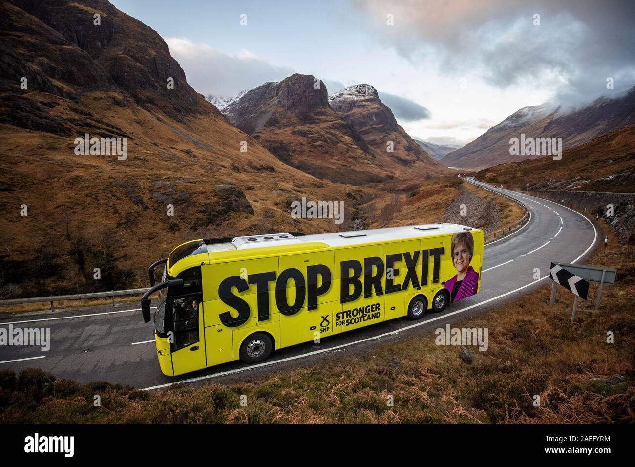 The SNP campaign bus travels up the Pass of Glencoe in the Highlands during its tour of Scotland in the final week of the General Election campaign. Stock Photo