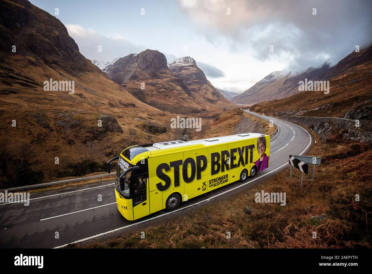 The SNP campaign bus travels up the Pass of Glencoe in the Highlands during its tour of Scotland in the final week of the General Election campaign. Stock Photo