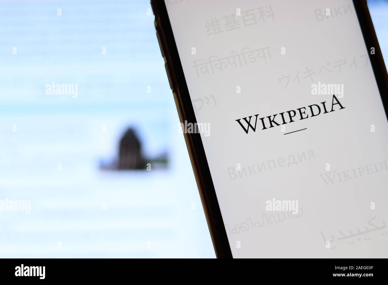 Los Angeles, California, USA - 21 November 2019: Wikipedia logo on phone screen with icon on laptop on blurry background, Illustrative Editorial. Stock Photo