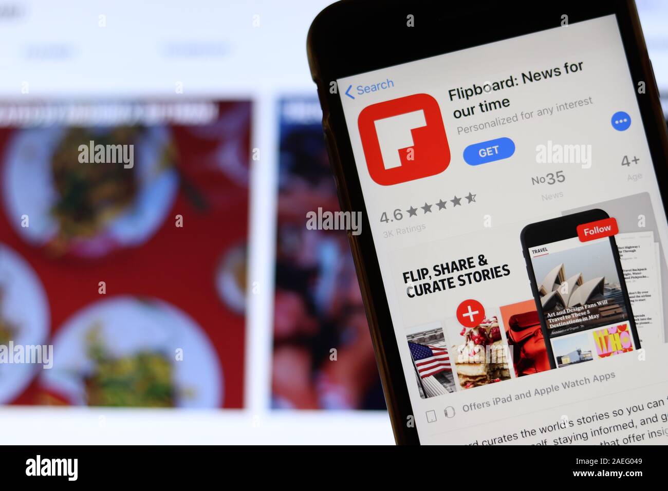 Los Angeles, California, USA - 21 November 2019: Flipboard logo on phone screen with icon on laptop on blurry background, Illustrative Editorial. Stock Photo