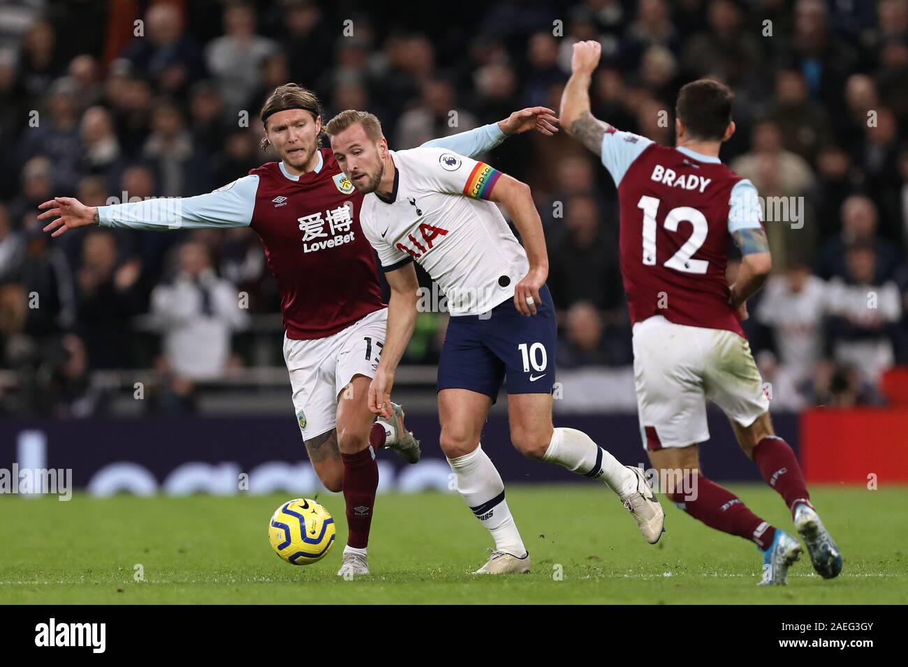 Harry Kane of Tottenham Hotspur in action with Jeff Hendrick (L) and Robbie Brady (R) of Burnley - Tottenham Hotspur v Burnley, Premier League, Tottenham Hotspur Stadium, London, UK - 7th December 2019  Editorial Use Only - DataCo restrictions apply Stock Photo