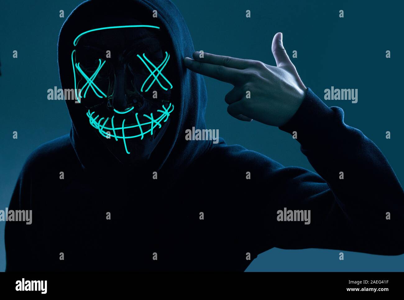 Anonymous hacker in black hoodie hi-res stock photography and images