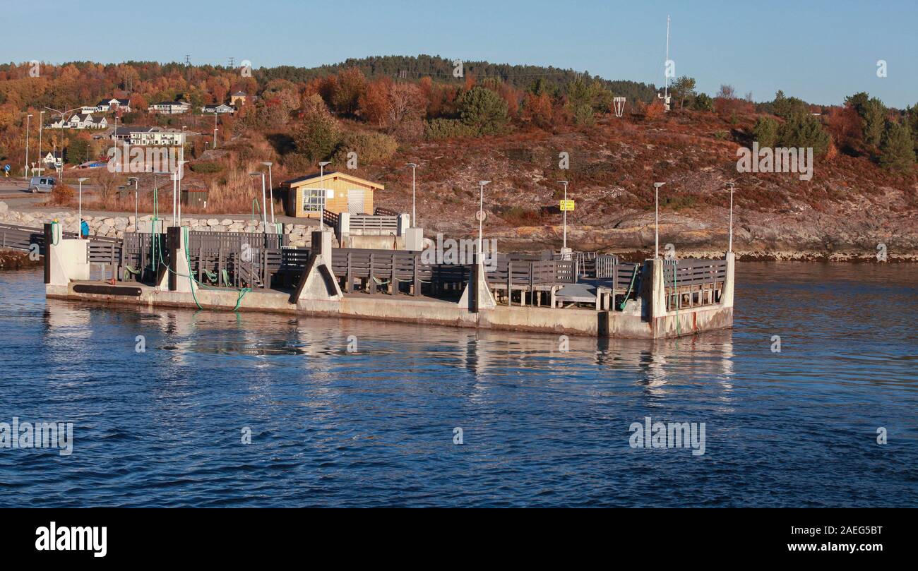 Norwegian coastal landscape with pier for ferry mooring operations. Sandstad, Hitra, Norway Stock Photo