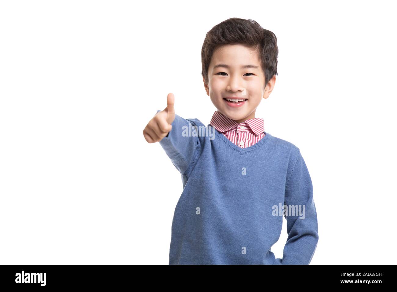 Happy little boy doing thumbs up Stock Photo - Alamy