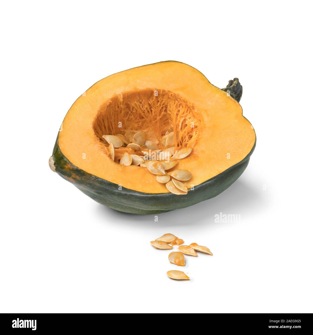 Halved fresh green acorn squash with seeds close up isolated on white background Stock Photo