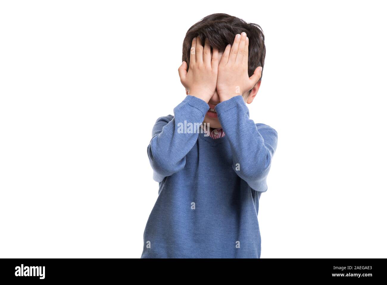 Little boy covering his eyes with hands Stock Photo - Alamy